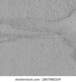  Intricate Patterns of a Textured Surface

This image highlights a close-up view of a textured surface, characterized by delicate lines and wavy patterns. The monochromatic tones create a striking contrast, emphasizing the intricate details that may often go unnoticed. The texture is reminiscent of natural formations, evoking a sense of organic beauty. These layers invite a tactile response, suggesting depth and richness. The rhythmic undulations create an engaging visual flow, drawing the viewer's gaze across the surface. This artwork encourages appreciation for the understated elegance of everyday materials, celebrating the artistry inherent in texture and form in our surroundings.