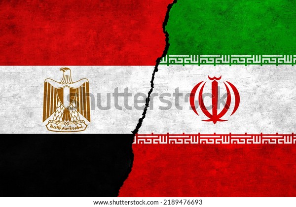 Iran and Egypt flags\
on a wall with a crack. Egypt and Iran flag together. Iran Egypt\
alliance, politics, economy, trade, relationship and conflicts\
concept