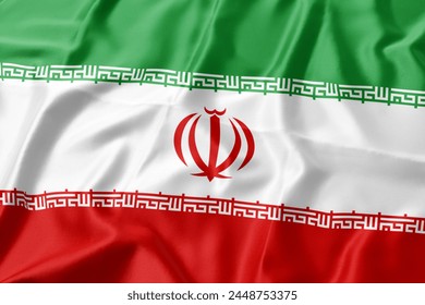 Iran flag blowing in the wind. Close up, soft and smooth silk. Fabric texture banner background. Use it for the concept of national day and occasions in the country