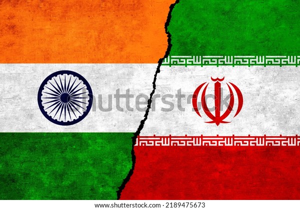 Iran and India flags\
on a wall with a crack. India and Iran flag together. Iran India\
alliance, politics, economy, trade, relationship and conflicts\
concept