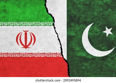 Iran and Pakistan painted flags on a wall with a crack. Pakistan and Iran relations. Iran and Pakistan flags together. Iran vs Pakistan