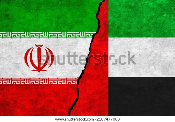 Iran and United Arab\
Emirates flags on a wall with a crack. UAE and Iran flag together.\
Iran UAE alliance, politics, economy, trade, relationship and\
conflicts concept