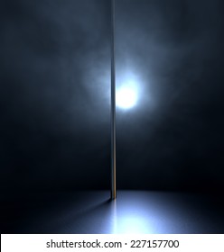 An Isolated Stripper Pole On A Stage Lit By A Single Spotlight On A Dark Background