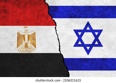 Israel and Egypt painted flags on a wall with a crack. Israel and Egypt conflict. Egypt and Israel flags together. Egypt vs Israel