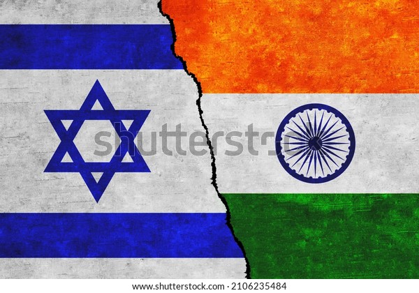 Israel and India painted flags on a wall with a\
crack. Israel and India relations. India and Israel flags together.\
India vs Israel