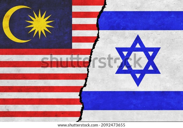 Israel and Malaysia painted flags on a wall with\
a crack. Israel and Malaysia conflict. Malaysia and Israel flags\
together. Israel vs\
Malaysia