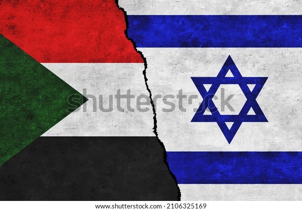 Israel and Sudan painted flags on a wall with a\
crack. Israel and Sudan relations. Sudan and Israel flags together.\
Sudan vs Israel