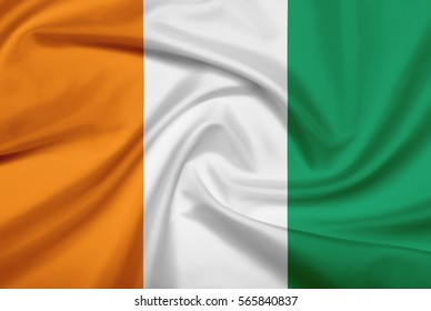 Ivory Coast flag with fabric texture. Flag of Cote D'ivoire. 3D illustration.