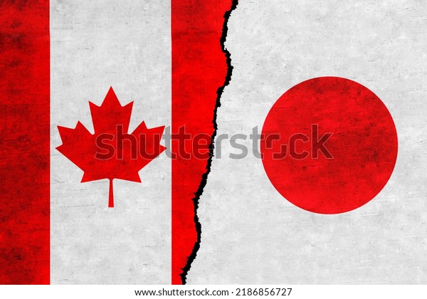 Japan and\
Canada painted flags on a wall with a crack. Japan and Canada\
relations. Canada and Japan flags\
together