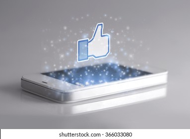 Johor, Malaysia - Jan 1, 2016: Smartphone With 3d Facebook Like Icon. Like Icon Button Is The Voting System Used To Rate User Comments On Facebook, Jan 1, 2016 In Johor, Malaysia.