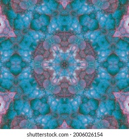 A kaleidoscope pattern formed by lines and spots of natural stone texture. Amazing natural patterns and textures of slice of brown and white minerals. The image with the mirror effect.