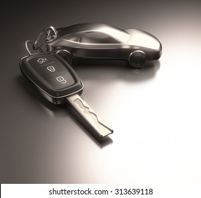 Key car and key ring over the metallic table. Clipping path included.