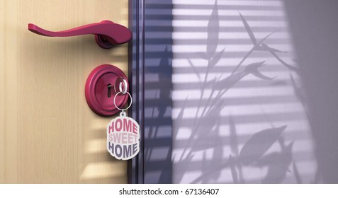 Key Chain With Home Sweet Home Written On It. The Key Is Inserted Into A Lock, The Handle Is Visible And There Is Copyspace On The Left Side Of The Picture