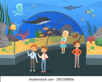 Kids In Aquarium. Family Walk Thru Underwater Museum With Fishes And Algae Big Aquarium Tank Background