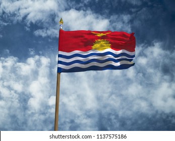 Kiribati flag Silk waving flag of Kiribati made transparent fabric with wooden flagpole gold spear on background sunny blue sky white smoke clouds real retro photo Countries of world 3d illustration - Powered by Shutterstock