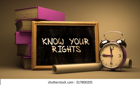 Know Your Rights Handwritten on Chalkboard. Time Concept. Composition with Chalkboard and Stack of Books, Alarm Clock and Scrolls on Blurred Background. Toned Image. - Powered by Shutterstock