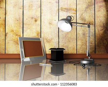 Lamp, Photoframe, Pens On The Table