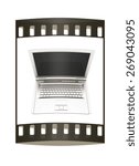 Laptop computer with black screen. View from top close-up. The film strip