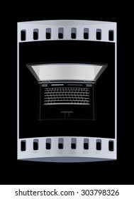 Laptop computer with black screen. View from top close-up. The film strip