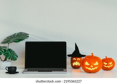 Laptop With Halloween Pumpkins. 3D Render