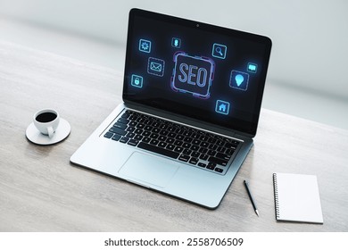 Laptop on a wooden desk showing SEO icons on screen, glowing symbols, notebook, and coffee cup nearby. Concept of digital marketing. 3D Rendering.