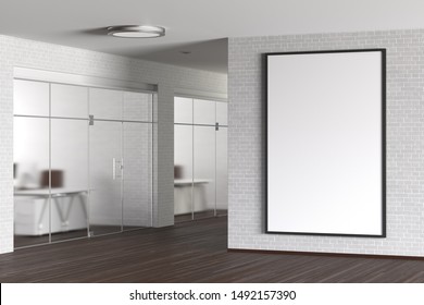 Large Blank Vertical Poster On The White Brick Wall In Modern Office. 3d Illustration