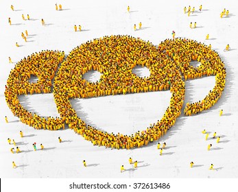 Large and diverse group of people dressed in yellow clothes gathered together in the shape of three happy faces - Powered by Shutterstock