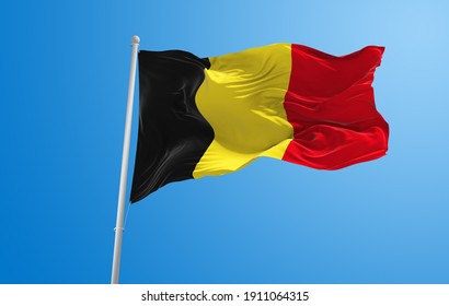 Large flag of Belgium  waving in the wind on flagpole against the sky with clouds on sunny day. 3d illustration