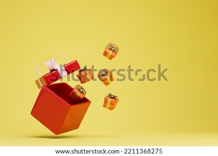 a large gift box from which small boxes with gifts on a yellow background fly out. copy paste, copy space. 3D render.