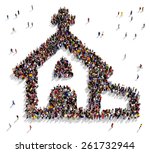 Large group of people seen from above gathered together in the shape of a church