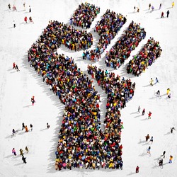Large Group Of People Seen From Above Gathered Together In The Shape Of A Fist Symbol Standing On A Grungy Background