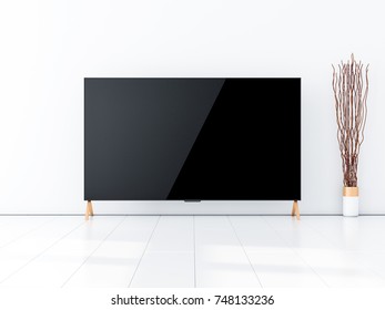 Large Smart Tv On The Floor In White Modern Interior. 3d Rendering