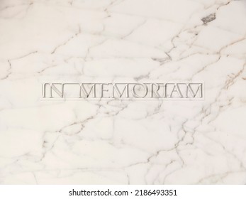 The Latin Text In Memoriam (meaning In Loving Memory) Carved On A Yellow Aging Marble Stone. Sober, Formal Message.
