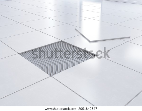 Laying tiles concept. Laying the ceramic tile\
on the floor - 3d\
rendering