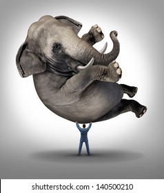 Leadership Solutions Business Concept As A Take Charge Businessman Lifting An Elephant As An Icon Of A Leader With Courage And Determination To Release The Power Within And Achieve The Impossible.