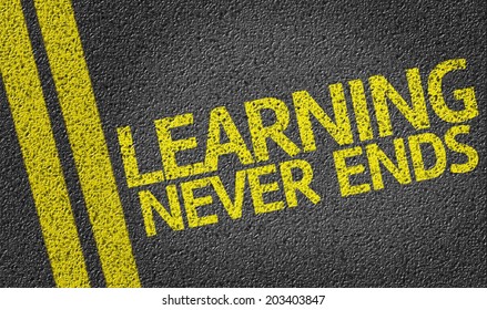 Learning Never Ends written on the road