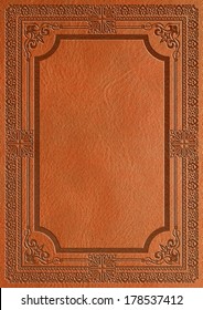 Leather cover with decorative ornament.