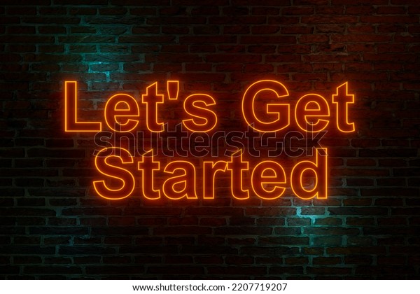 Let\'s get\
started, neon sign. Brick wall at night with the text \