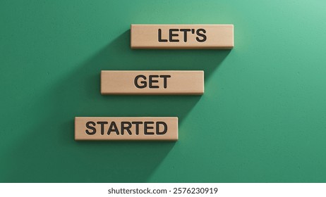 Lets get started symbol. Concept words Lets get started on wooden blocks.Business and Lets get started concept. Copy space.3D rendering on green background.