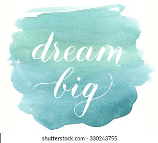 Lettering "Dream big" on watercolor background