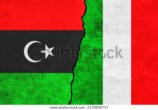 Libya and Italy\
painted flags on a wall with a crack. Italy and Libya\
relations.Libya and Italy flags\
together
