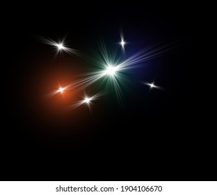 light effect of shining stars on a black background with green blue and red tint