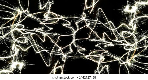 Light effects. Fire show. Festive decoration. Abstract blurred background. Glowing texture. Shining pattern.