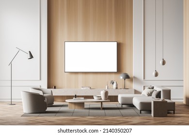 Light Living Room Interior With Sofa And Armchairs, Tv On Wall. Coffee Table And Stand With Decoration, Carpet On Hardwood Floor. Mock Up Blank Screen. 3D Rendering