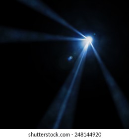 Light of a searchlight beams through a smoke. Background in show