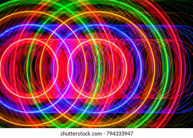 Light trails formed by the circular movements of several LEDs that turn on and off following different patterns

