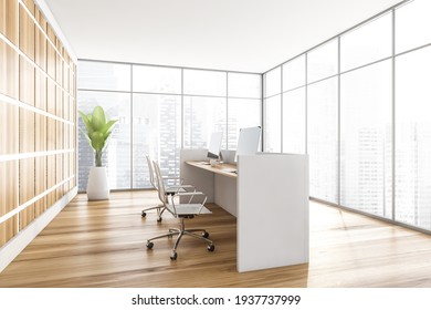 Light Wooden Office Interior With White Desk And Armchairs With Computers, Plant On Parquet Floor, Side View. City View On Skyscrapers, 3D Rendering No People