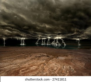 Lightning and ominous clouds over a desert plain and distant lake