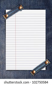 lined note paper on blue jeans background