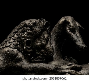 Lion Hunting Bronze Sculpture Close Up Scene Isolated On Black Background Photo